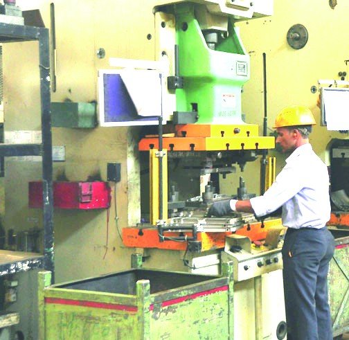 Pneumatic press machines, operators at work