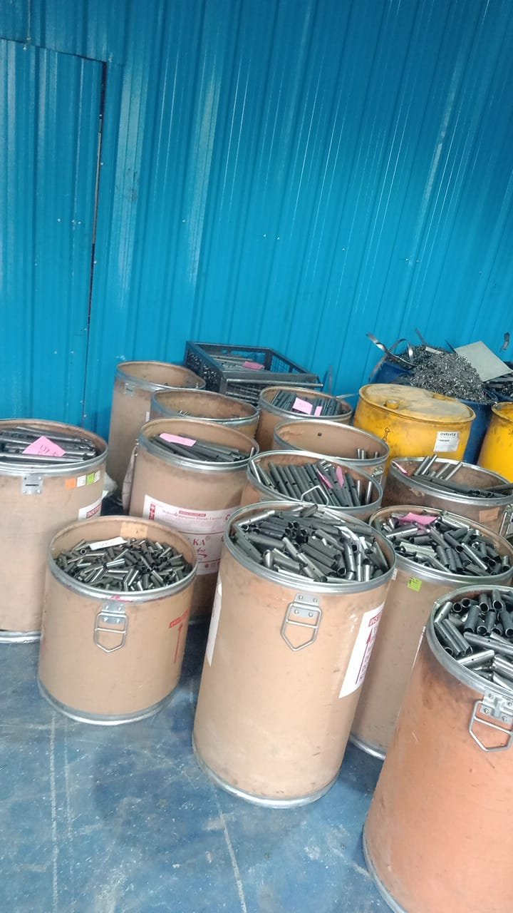 Cut tube stock sorted into labelled barrels